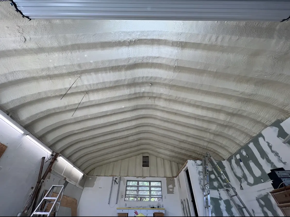 Spray polyurethane foam applied to the underside of a metal roof deck in Crystal Lake